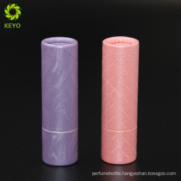 empty cosmetic container round pink violet colored paper lipstick tube